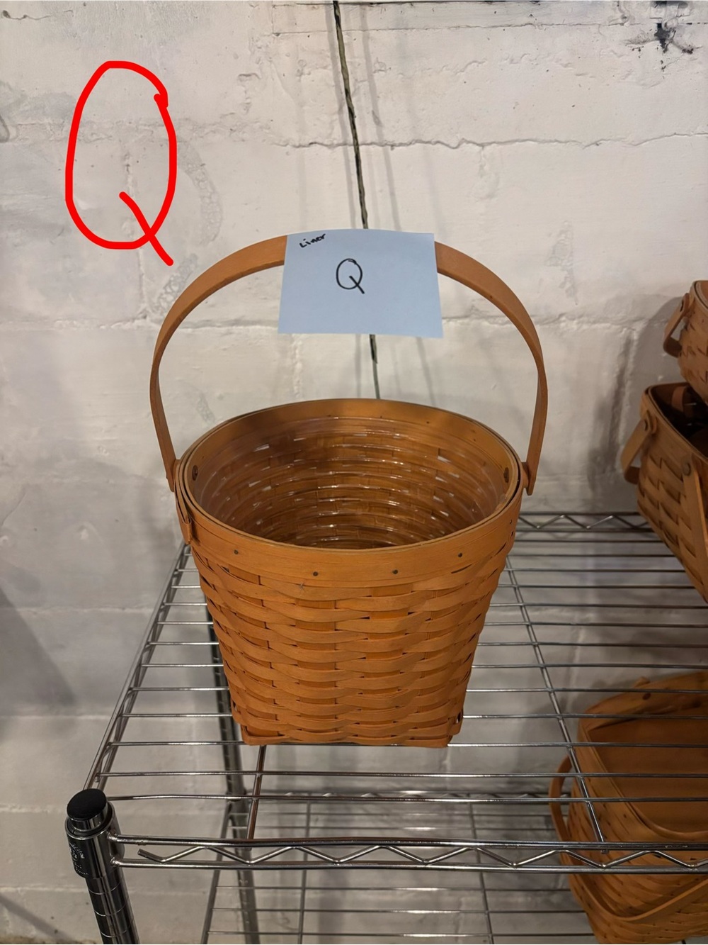 Longaberger woven basket in warm brown with handle
